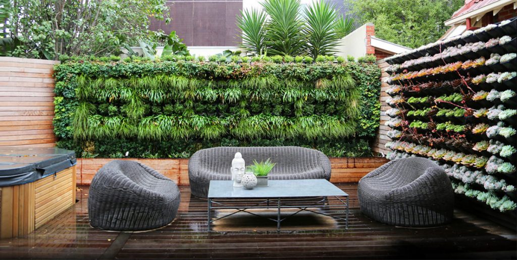 modern-living-room-ideas-with-grey-finish-rattan-chair-and-rectangle-metal-coffee-table-above-dark-brown-hardwood-floor-also-beautiful-vertical-garden-planters-attached-on-wall-decor-1200x603